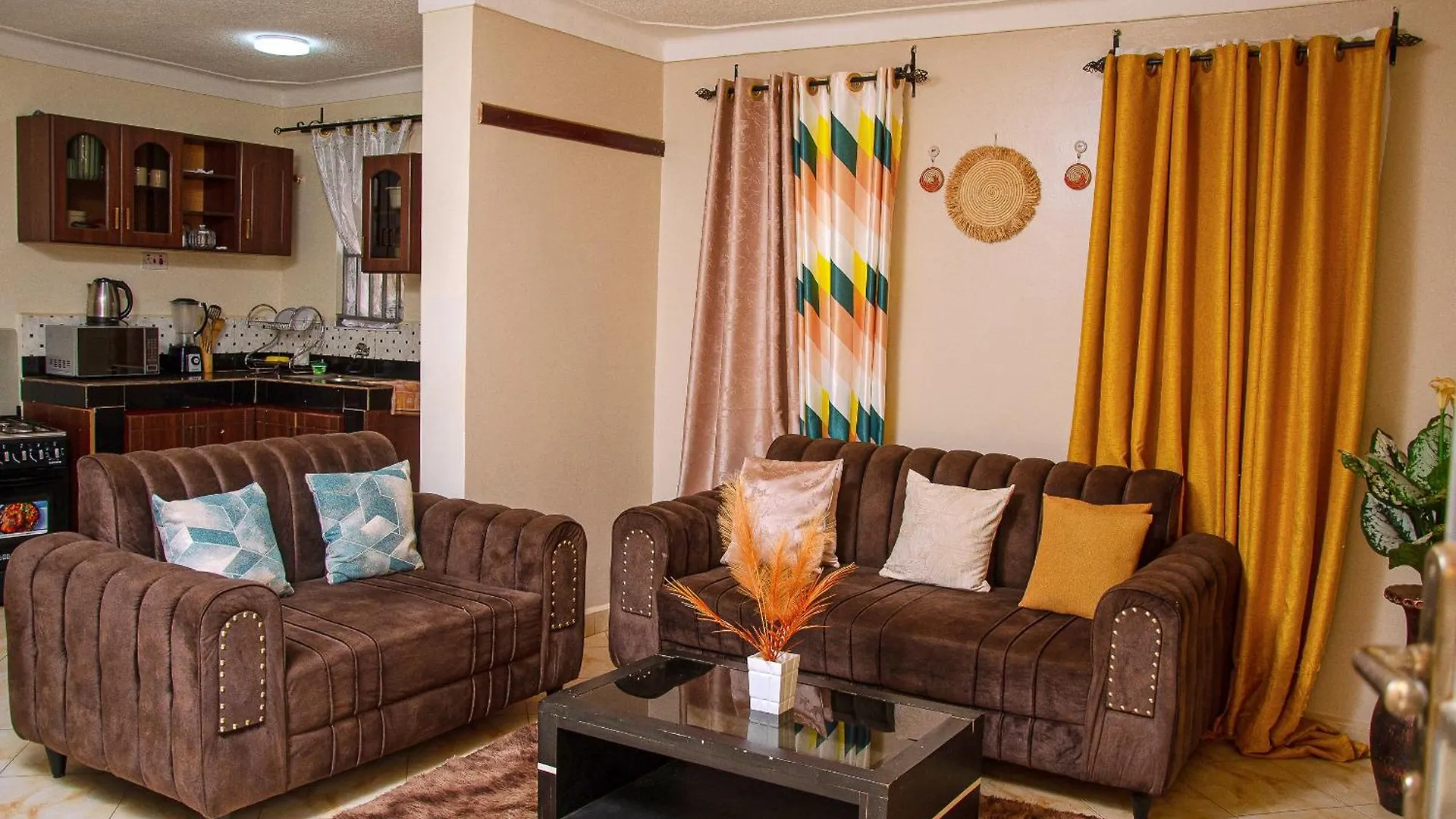 Muggiez Olive, Kira Apartment Kampala